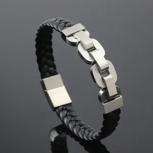 Macro detail of braided black leather bracelet with stainless steel chain links