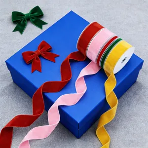 Velvet ribbon rolls and bows in vibrant colors for gift wrapping, clothing and hair accessories.
