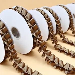Detailed view of ruffled satin ribbon spools in bronze, ideal for gift wrapping and crafts.