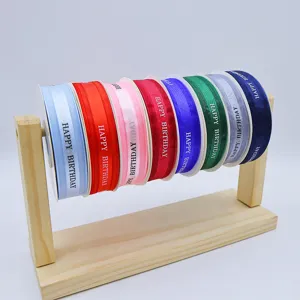 Colorful birthday printed ribbon rolls for gift wrapping, box packaging, and party decor.