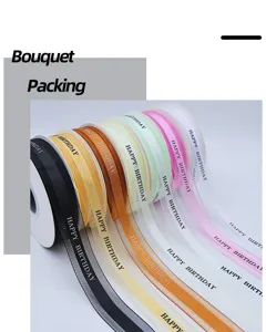 Detailed view of colorful happy birthday printed sheer ribbons for bouquet packing and gift wrapping.