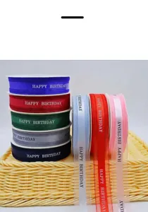 Colorful gift wrapping ribbon with happy birthday text, perfect for floral bouquets and boxes.