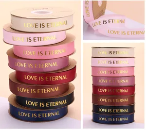 Colorful fabric ribbon with gold stamped love text, perfect for gift wrapping and floral bouquets.