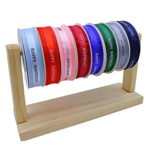 Colorful satin ribbon rolls set with wooden display stand for gift box and party decoration.