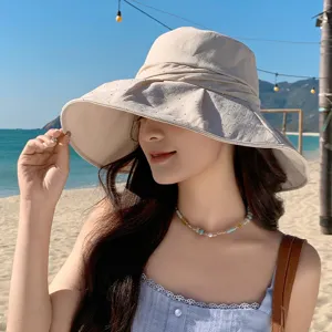 Detail of women's wide brim rhinestone sun hat, perfect beach vacation uv protection headwear.