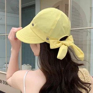 Cappello da sole donna moda estiva protezione UV con dettaglio fiocco posteriore elegante.