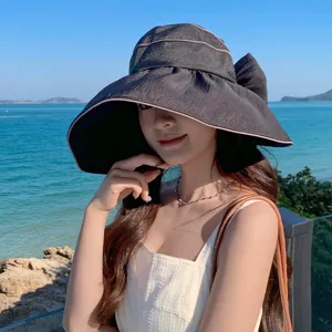 Modischer großer Sonnenhut mit eleganter Schleife, ideales Outdoor Strandaccessoire für Damen.