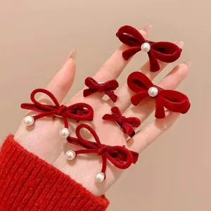 Red flocked pearl bow hair clip detail, cute small side clip for women and girls daily wear.