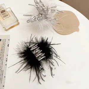Trendy metal feather hair claw clip, chic minimalist style ponytail holder for women and girls.