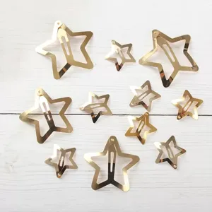 Close-up detail of gold star hair clips, multi-size metal y2k bb hairpins for women styling.