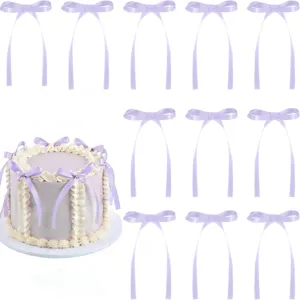 Detailed view of light purple ribbon bows for cake decoration and party scene layout.