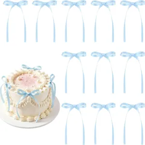 Light blue ribbon bow cake decoration details and scene display, elegant party decor.