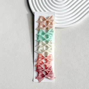 Detailed view of colorful grosgrain ribbon swallowtail hair bow clips set for women and girls.
