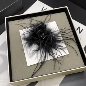 Black ostrich feather hair claw clip, elegant fluffy shark clip for half-tied hairstyles.