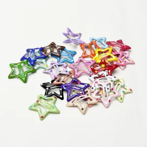 Colorful metal star hair clips with cute polka dots, detail view showing vibrant hair accessories.