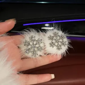 Fluffy snowflake hair clip with sparkling rhinestones for cute autumn and winter styling.