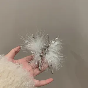 Liquid metal butterfly hair claw with white ostrich feathers, chic edgy styling hair clip.