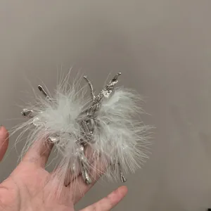 Silver liquid butterfly hair claw with white ostrich feathers, sweet and cool style.