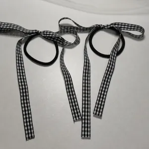Detail view of black and white plaid bow hair ties, sweet Japanese style scrunchies.