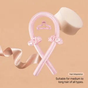 Detailed view of the champagne pink heatless curling rod set showing smooth satin texture.