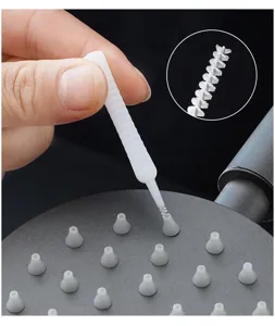 Close-up detail showing the ultra-fine spiral bristles of the mini shower hole cleaning brush.