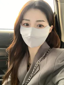 Ice silk sun protection face mask detail shot, breathable thin fabric design for women outdoor.