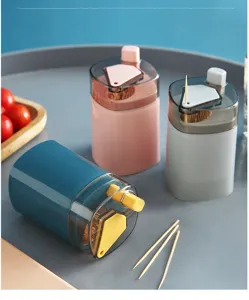 Press-type automatic pop-up transparent toothpick dispenser container for kitchen home use.
