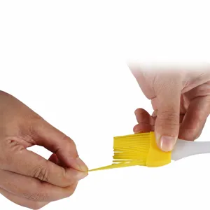 Portable silicone oil brush for BBQ and cooking, flexible bristles for even oiling.