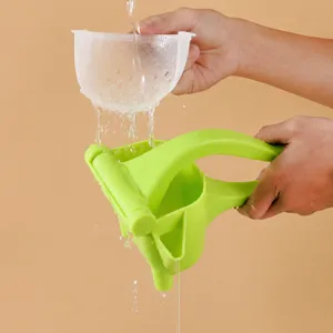 Presse-agrumes manuel, extracteur de citron portable avec panier filtre pour jus de fruit.