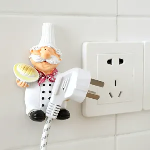 Cartoon chef wall hook for power cord storage, adhesive cable organizer for home kitchen decor.