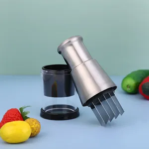 Close-up detail view of the stainless steel garlic press blades and transparent container.