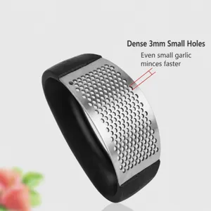 Stainless steel garlic press detail showing durable brushed metal finish and 3mm small holes.