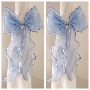 Large shimmer organza bow ribbon hair clip or curtain tieback with long flowing tails.