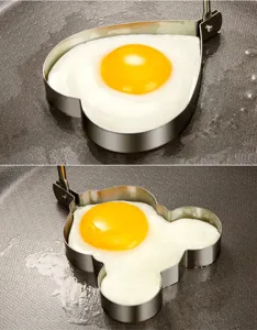 Stainless steel fried egg mold set with heart and cartoon shapes for breakfast cooking.