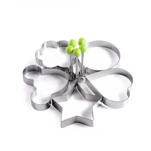 Stainless steel fried egg ring mold set with multi shapes and green handles for kitchen.