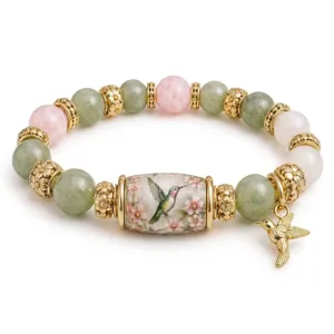 Hummingbird beaded bracelet with green jade and pink rose quartz stones and gold charm