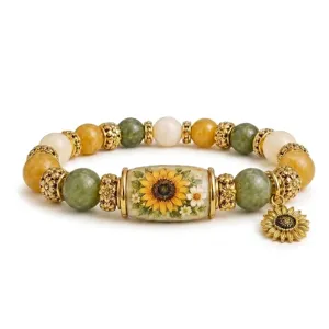 Detailed macro shot of a gemstone sunflower bracelet with green and amber beads.