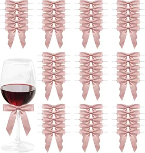 Pink satin ribbon bows detail view, perfect for DIY gift wrapping and party decorations.