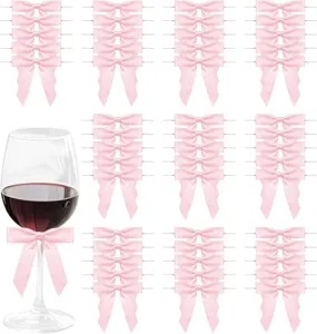 Close-up detail of pink ribbon bows with wire ties, ideal for party decor, gift wrapping and crafts.