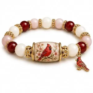 Macro view showing the cardinal bird charm and beaded bracelet with floral details