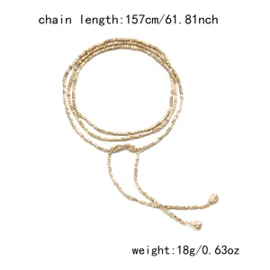 Detail view of a 157cm long gold beaded Y-shaped wrap necklace with weight and length specs