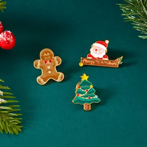 Set di spille natalizie in smalto con omino di pan di zenzero e un Babbo Natale