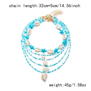 Detailed view of a bohemian multi-layer seashell beaded necklace with blue beads.