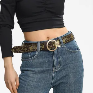 Detail view of a western cowboy style leather belt featuring gold butterfly embossing