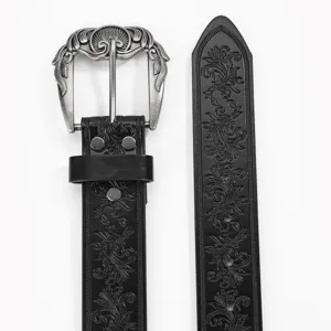 Close-up of black retro belt with embossed floral pattern and ornate silver buckle
