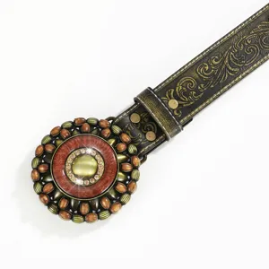 Detailed macro view of vintage Western leather belt buckle with rhinestone accents