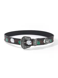 Vintage bohemian women's leather belt featuring floral embossing and ornate metal buckle