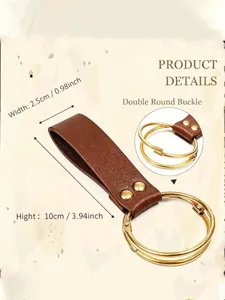 Detail of brown leather belt loop with golden double rings and dimensions 10x2.5cm