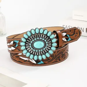 Vintage bohemian leather belt featuring a large turquoise floral buckle and feather accents.