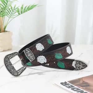 Vintage Bohemian distressed women's belt with floral embossing and ornate silver buckle
